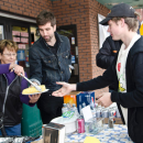 Volunteers serving corn